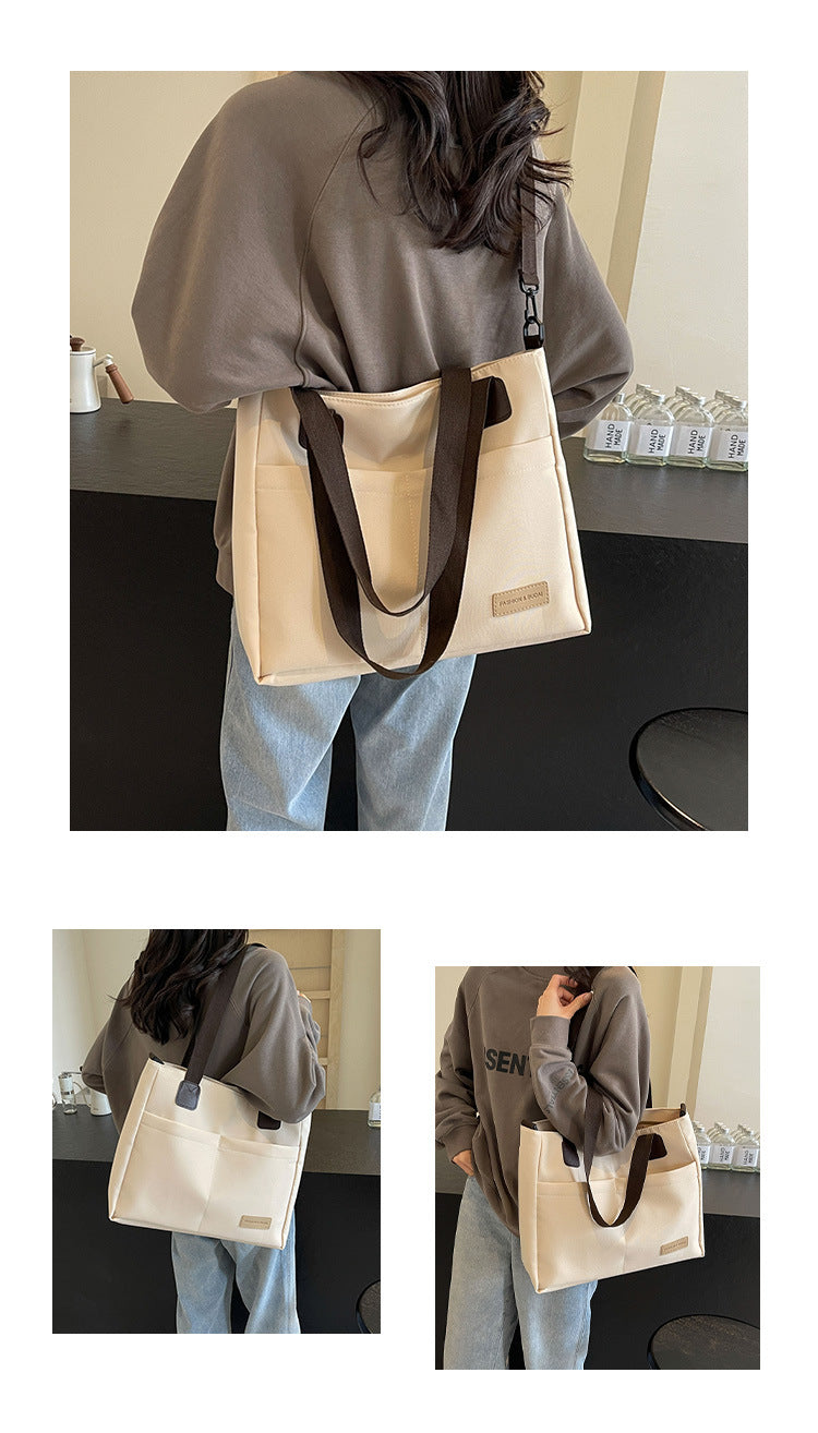 Stylish white canvas tote bag with detachable shoulder strap