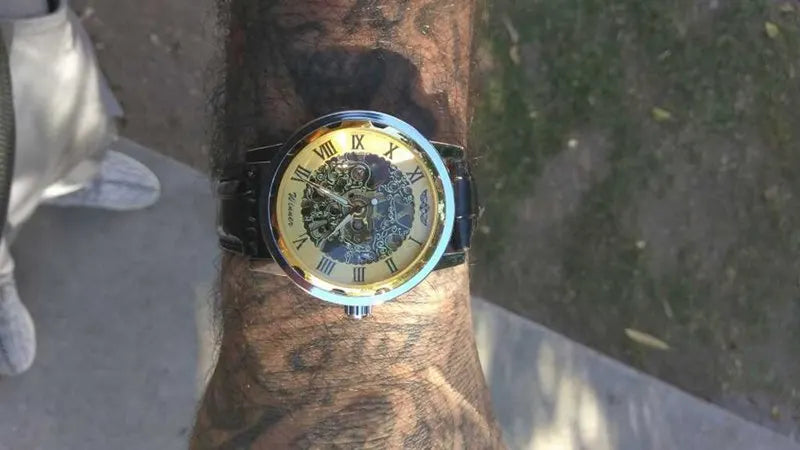 Winner Luxury Skeleton Mechanical Watch – Black Leather Strap, Gold Dial, Stainless Steel Case