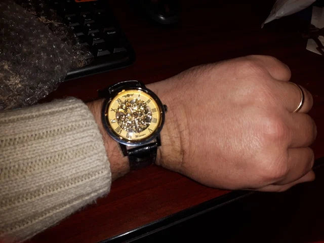 Winner Luxury Skeleton Mechanical Watch – Black Leather Strap, Gold Dial, Stainless Steel Case